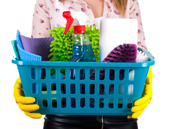 person holding cleaning supplies
